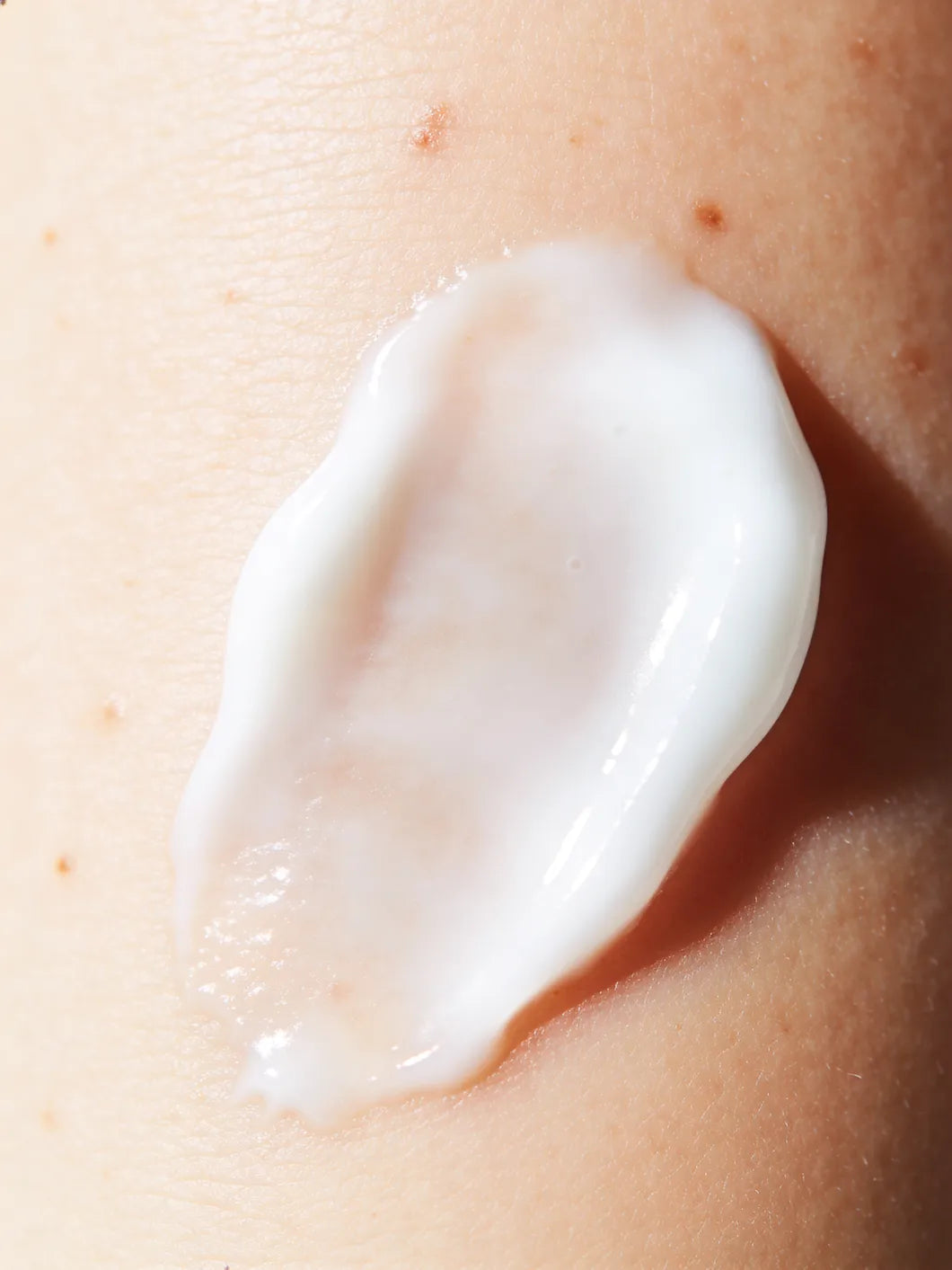 Yelf Aging Bye Bye Nourishing Day Cream as a lightweight, smooth texture on skin in an ultra-close macro shot