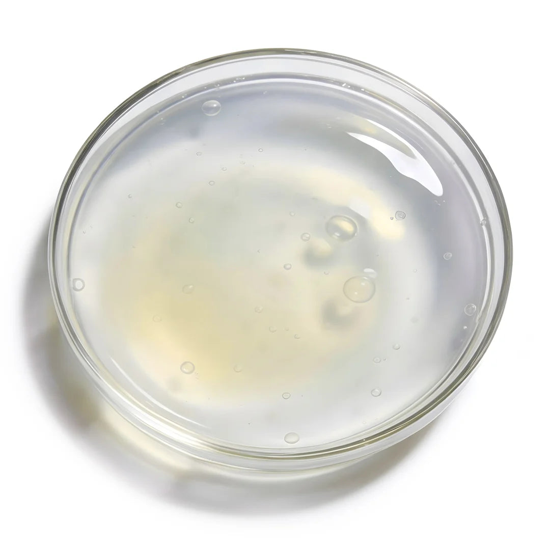 Alpha-arbutin represented by a slightly milky transparent gel in a glass petri dish on a white background, this is Yelf Spot Off Pigment Fix Serum.