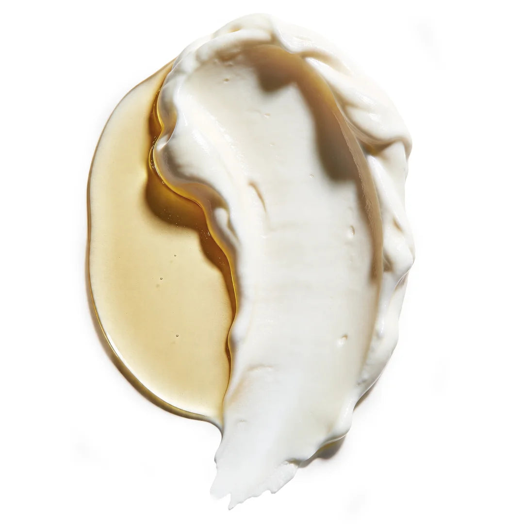 Yelf Spot Off Brightening Eye Cream texture with creamy formula and golden nourishing oil merging smoothly on a clean white background, top view.