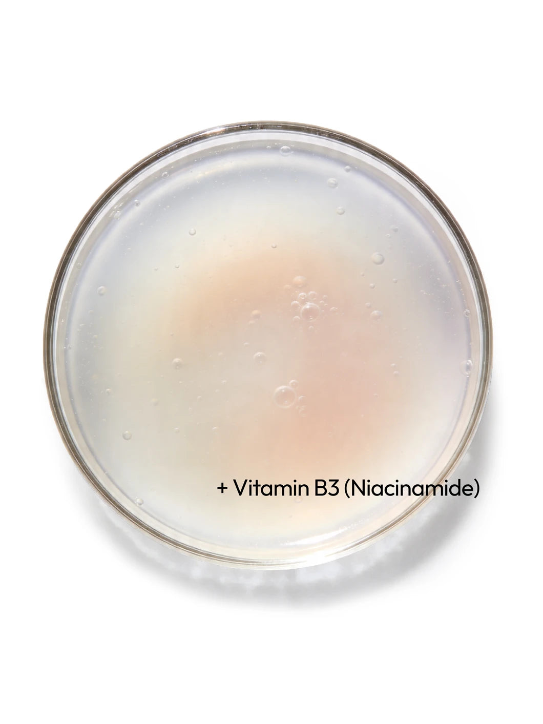 Top view of niacinamide (vitamin B3) in a lightweight liquid texture in a petri dish, illustrating balancing and refining ingredients used in Yelf Spot Off Vitamin B3 Gel
