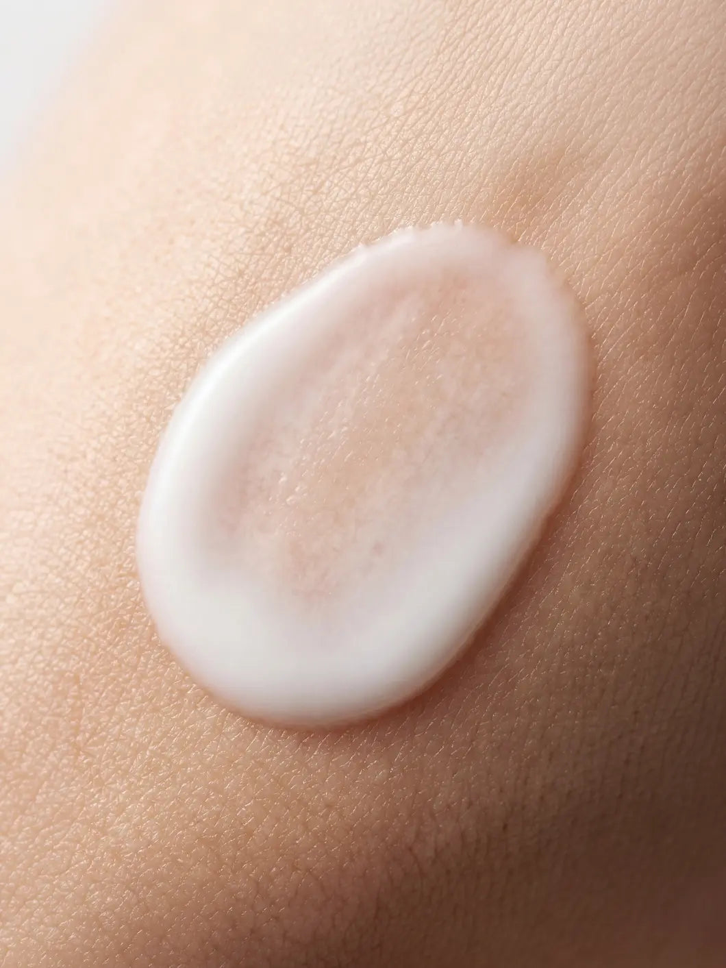Yelf Viva el Boost Collagen Serum – milky lightweight fluid texture applied on skin in close-up